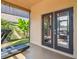 Relaxing screened-in sunroom featuring a home gym area and outdoor seating at 1314 Oak Pond St, Ruskin, FL 33570