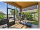 Relaxing screened-in sunroom featuring a home gym area and outdoor seating at 1314 Oak Pond St, Ruskin, FL 33570