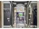 Mirrored closet doors offer a glimpse into a bedroom, blending storage with style and light at 1314 Oak Pond St, Ruskin, FL 33570