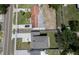Aerial view of property showcasing the house, driveway, and surrounding neighborhood at 1410 Nebraska Ave, Palm Harbor, FL 34683