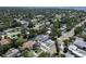 Aerial view of property with a blue border showing the house, driveway, and nearby homes at 1410 Nebraska Ave, Palm Harbor, FL 34683