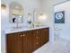 Bathroom with double vanity, modern mirrors, and stylish fixtures and decor at 1410 Nebraska Ave, Palm Harbor, FL 34683