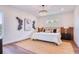 Serene bedroom showcasing neutral tones, hardwood floors, and stylish decor for a relaxing retreat at 1410 Nebraska Ave, Palm Harbor, FL 34683