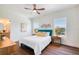 Stylish bedroom featuring two windows and wood floors at 1410 Nebraska Ave, Palm Harbor, FL 34683