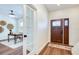 Inviting home entryway with a stylish front door, warm wood floors, and an adjacent office space for a modern, functional appeal at 1410 Nebraska Ave, Palm Harbor, FL 34683
