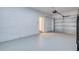 Spacious garage with a white block wall and plenty of room for storage at 1410 Nebraska Ave, Palm Harbor, FL 34683