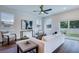 Cozy living room features modern decor, hardwood floors, and sliding glass doors to the backyard at 1410 Nebraska Ave, Palm Harbor, FL 34683