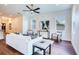 Bright living room featuring a modern sofa, hardwood floors, and ample natural light at 1410 Nebraska Ave, Palm Harbor, FL 34683