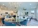 Modern living space with open kitchen, dining area, and hardwood floors at 1410 Nebraska Ave, Palm Harbor, FL 34683