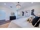 Bright main bedroom featuring a modern chandelier and stylish decor at 1410 Nebraska Ave, Palm Harbor, FL 34683