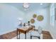 Bright home office featuring neutral walls, wood floors, white trim and stylish decor, perfect for a productive workspace at 1410 Nebraska Ave, Palm Harbor, FL 34683