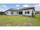 Exterior view of house featuring a lush green lawn and manicured landscaping at 14279 Swiss Bridge Dr, Riverview, FL 33579