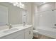 Bright bathroom features double sinks, quartz countertop, and a shower over tub at 14279 Swiss Bridge Dr, Riverview, FL 33579