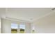Bright bedroom with large windows, tray ceiling and ample natural light at 14279 Swiss Bridge Dr, Riverview, FL 33579