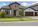 Charming single-story home featuring a stone facade, tile roof, and well-maintained landscaping at 14279 Swiss Bridge Dr, Riverview, FL 33579