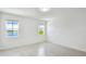 Bright bedroom with two windows and wood-look flooring at 14424 59Th E Cir, Bradenton, FL 34211