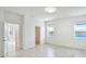Bright bedroom with wood-look flooring and view of the pond at 14424 59Th E Cir, Bradenton, FL 34211