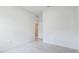 This bedroom offers a light-filled space with neutral walls and views into other rooms at 14424 59Th E Cir, Bradenton, FL 34211