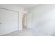 This bedroom features a spacious layout with white walls and wood-look flooring and a walk-in closet at 14424 59Th E Cir, Bradenton, FL 34211