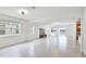 Bright living area with wood floors, modern furniture, light fixtures, and large windows that give ample natural light at 14424 59Th E Cir, Bradenton, FL 34211