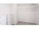 Bright walk-in closet features wire shelving and built in drawers for optimal storage space at 14424 59Th E Cir, Bradenton, FL 34211