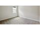 Bright bedroom with carpeted floors and neutral colored walls at 14523 Swiss Bridge Dr, Lithia, FL 33547