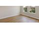 Bedroom with wood floors and windows providing bright natural light at 14523 Swiss Bridge Dr, Lithia, FL 33547