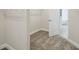Spacious walk-in closet with carpeted floors and white walls and shelving at 14523 Swiss Bridge Dr, Lithia, FL 33547
