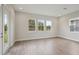 Bright living room with wood floors, recessed lights and many windows at 14531 Swiss Bridge Dr, Lithia, FL 33547