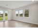 Bright living room with wood floors, recessed lights and many windows at 14531 Swiss Bridge Dr, Lithia, FL 33547