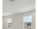Sun-filled room with two large windows offering a view of the outdoors at 14531 Swiss Bridge Dr, Lithia, FL 33547
