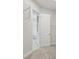 Walk-in closet leading to bathroom with wire shelving for clothing storage at 14531 Swiss Bridge Dr, Lithia, FL 33547