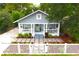 Charming home with meticulous landscaping and a cozy front porch at 1510 Mobile Ave, Tampa, FL 33610
