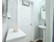Bathroom features a single sink, white door, and gray walls at 1510 Mobile Ave, Tampa, FL 33610
