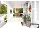 Relaxing front porch featuring a swing and decorative plants adding to the home's charm at 1510 Mobile Ave, Tampa, FL 33610