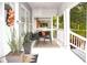 Cozy front porch with outdoor seating and charming architectural details at 1510 Mobile Ave, Tampa, FL 33610