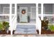 Inviting front porch with potted plants and steps leading up to the entrance at 1510 Mobile Ave, Tampa, FL 33610