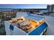Aerial view of expansive rooftop deck with outdoor kitchen and plenty of seating at 1581 Gulf Blvd # 701N, Clearwater Beach, FL 33767