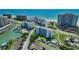 Stunning aerial view of beachfront condos and marina with boat docks, pool, and beautiful ocean views at 1581 Gulf Blvd # 701N, Clearwater Beach, FL 33767