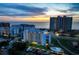 Stunning aerial view of the condo complex at sunset, featuring a pool and waterfront access at 1581 Gulf Blvd # 701N, Clearwater Beach, FL 33767