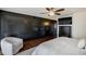 This elegant bedroom features dark wood floors, accent lighting, and custom storage at 1581 Gulf Blvd # 701N, Clearwater Beach, FL 33767
