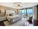 Bright bedroom offers a calm, relaxing space with a king bed and access to the balcony at 1581 Gulf Blvd # 701N, Clearwater Beach, FL 33767