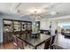 This elegant dining room features modern lighting, beautiful furnishings, and a dark wood china cabinet at 1581 Gulf Blvd # 701N, Clearwater Beach, FL 33767