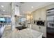 Modern kitchen featuring granite counters, stainless steel appliances, and an open layout at 1581 Gulf Blvd # 701N, Clearwater Beach, FL 33767