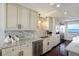 Elegant kitchen with granite countertops, stainless steel appliances, and waterfront views at 1581 Gulf Blvd # 701N, Clearwater Beach, FL 33767