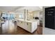 Bright, open kitchen featuring a large island with granite countertops and stainless steel appliances at 1581 Gulf Blvd # 701N, Clearwater Beach, FL 33767