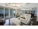 Bright and open living room with hardwood floors and sliding glass doors to a private balcony at 1581 Gulf Blvd # 701N, Clearwater Beach, FL 33767