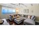 Inviting living room features water view, coffered ceiling, and comfortable sectional seating at 1581 Gulf Blvd # 701N, Clearwater Beach, FL 33767
