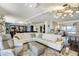 Spacious living room with elegant furnishings and an open floor plan to the kitchen and dining area at 1581 Gulf Blvd # 701N, Clearwater Beach, FL 33767