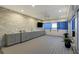 Rooftop terrace kitchen with stone wall, modern cabinets, grill, and beautiful sunset views at 1581 Gulf Blvd # 701N, Clearwater Beach, FL 33767